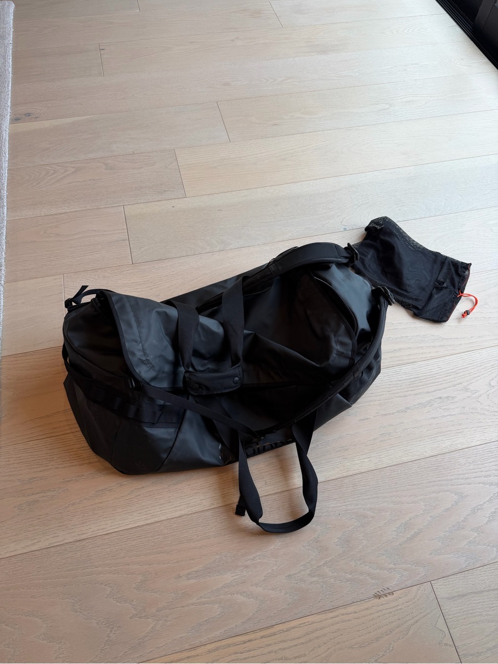cotopaxi Black Duffel with Carry Straps and storage bag